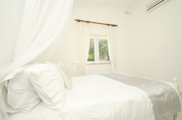 Silver bedroom with garden views